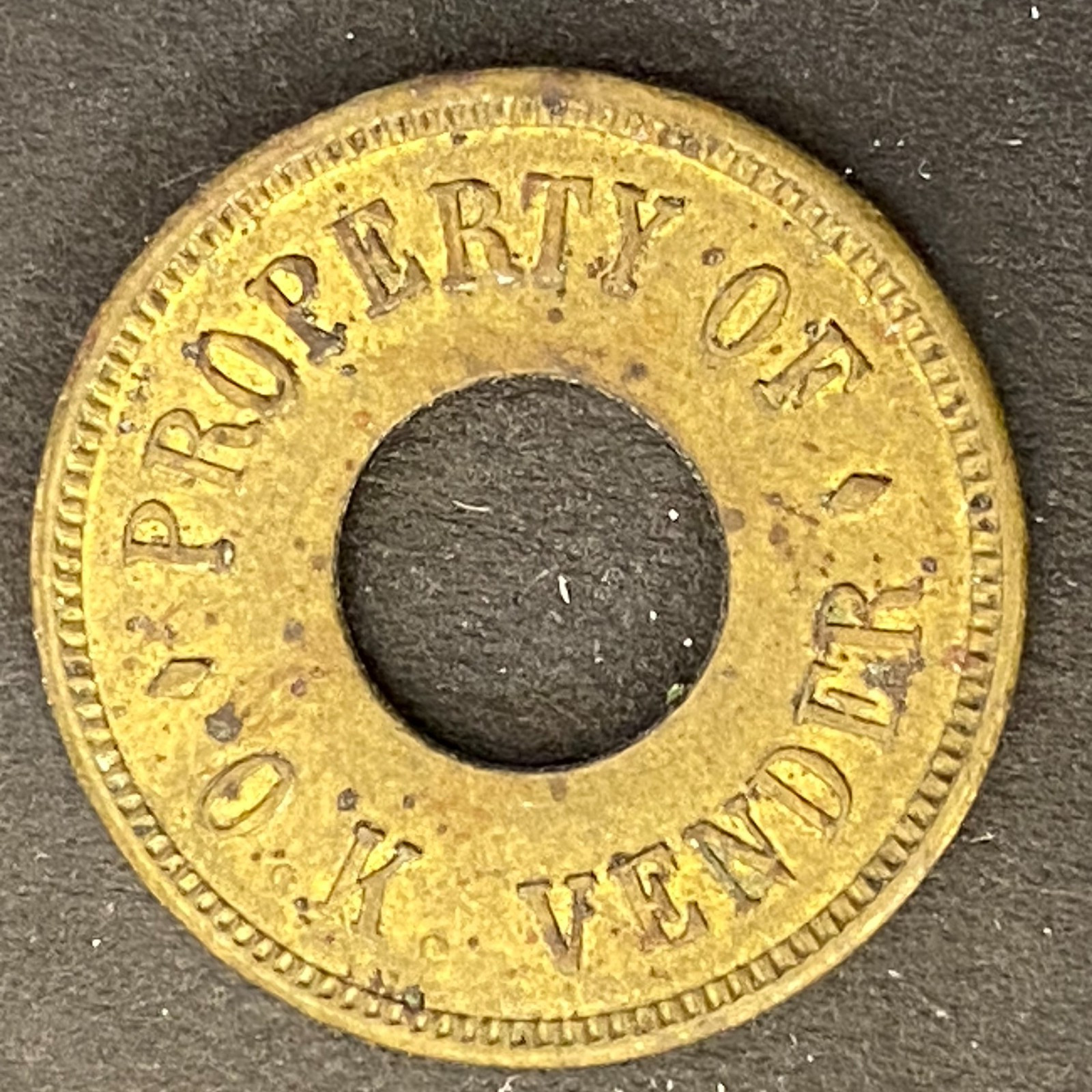 Property of O.K. Vendor Brass Amusement Trade Token 21mm
