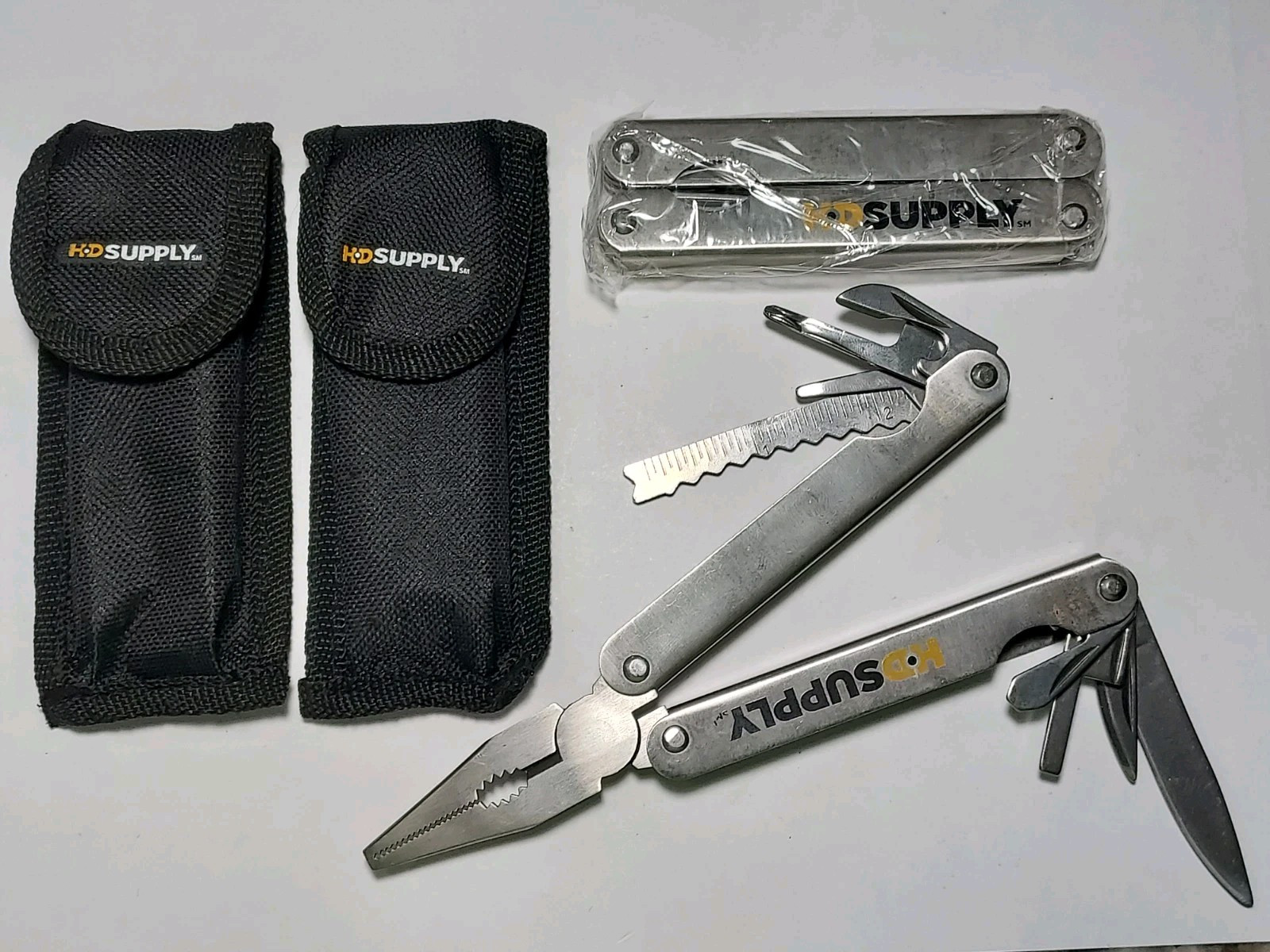 2 HD Supply Multi Tools with Nylon Pouch - 1 used, 1 new