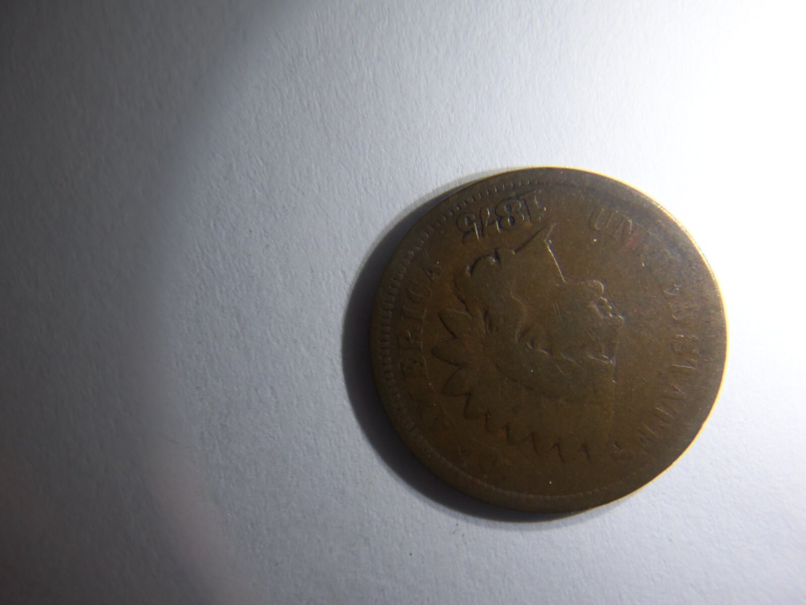 A KEY 1875 INDIAN HEAD PENNY