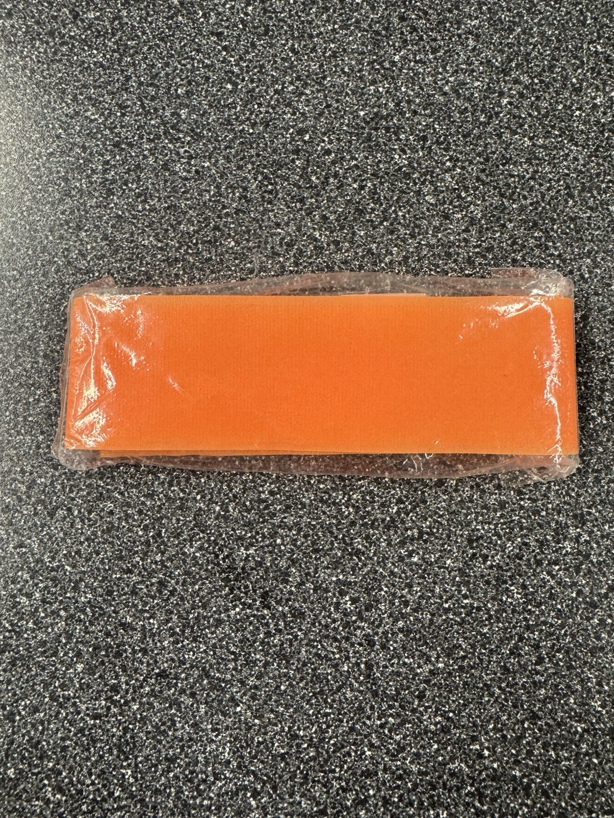 Orange arm band.  OSFM. NOS.