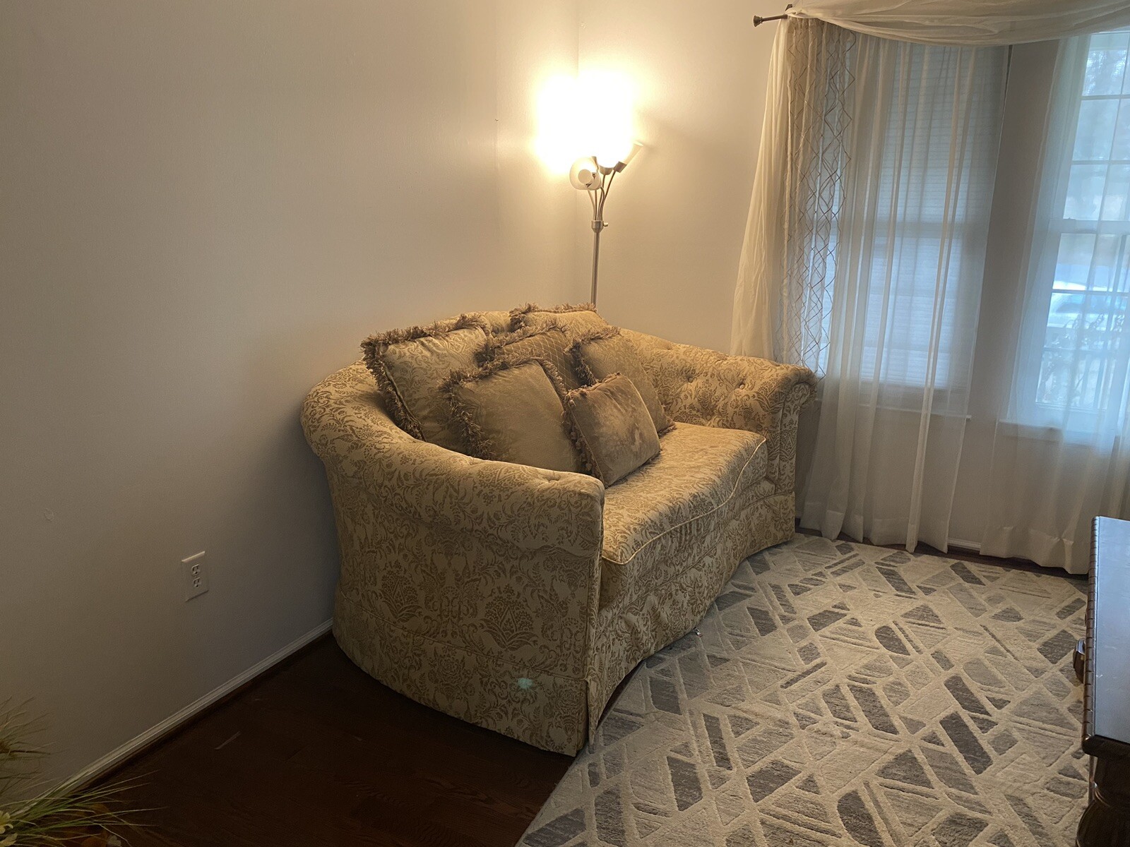 A Set Of Beige Sofas And A Coffee Table