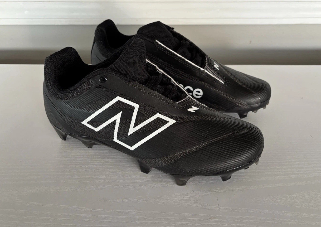 New Balance Unisex BurnX4 Lacrosse Shoe, Black/Blacktop, Men’s 5.5 Women’s 7