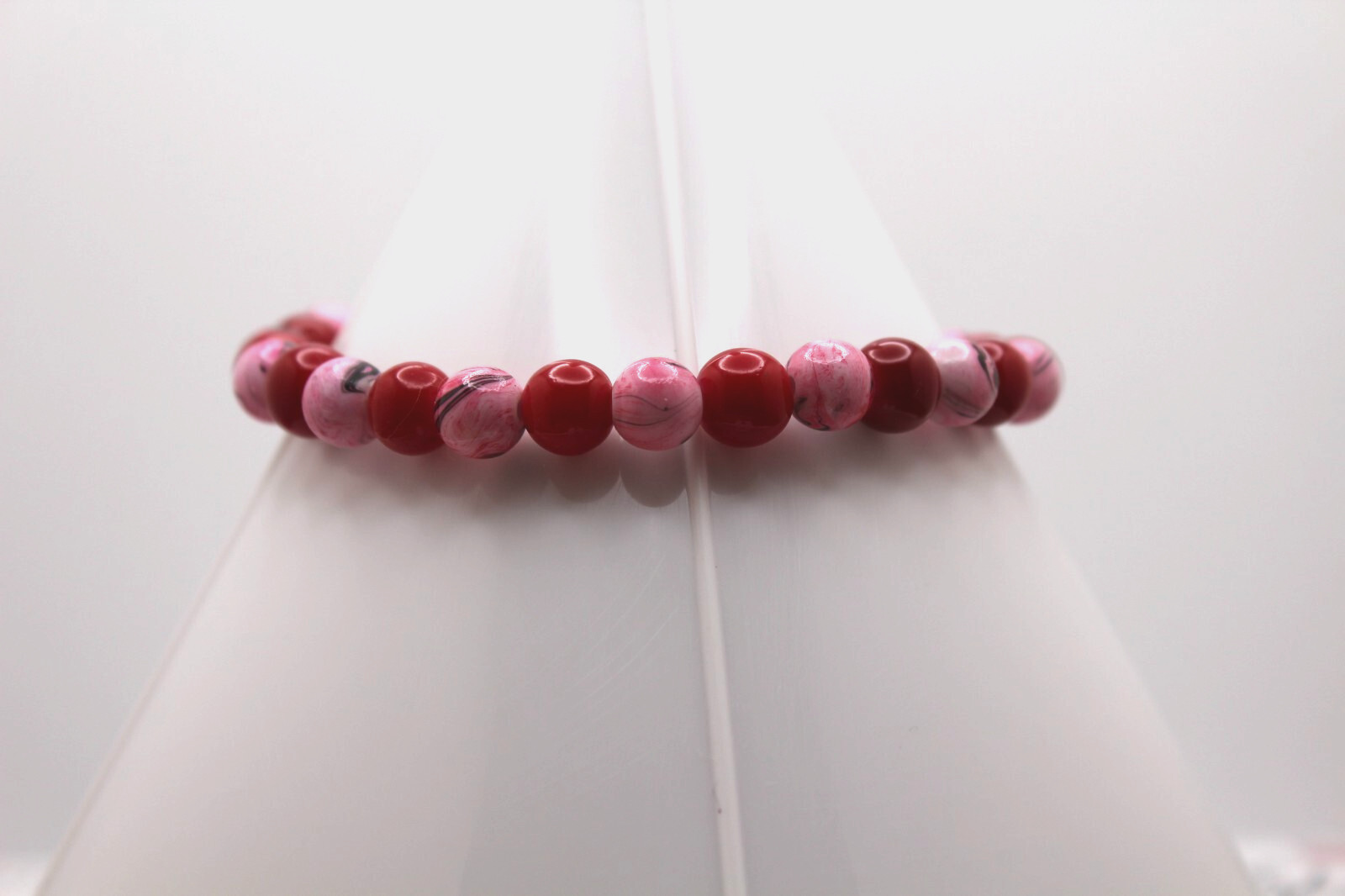 Handcrafted 8.75" red glass and pink swirled acrylic beads bracelet
