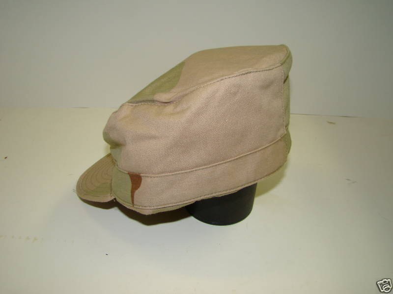 Tan Camouflage Hat with Ear Flaps.