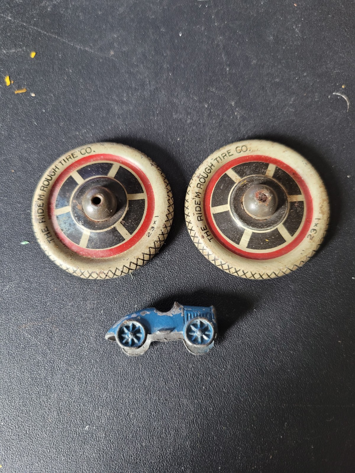 2 Vintage Tin Motorcycle Lithographed 5.7 cm hubcap wheels with a diecast CJ car