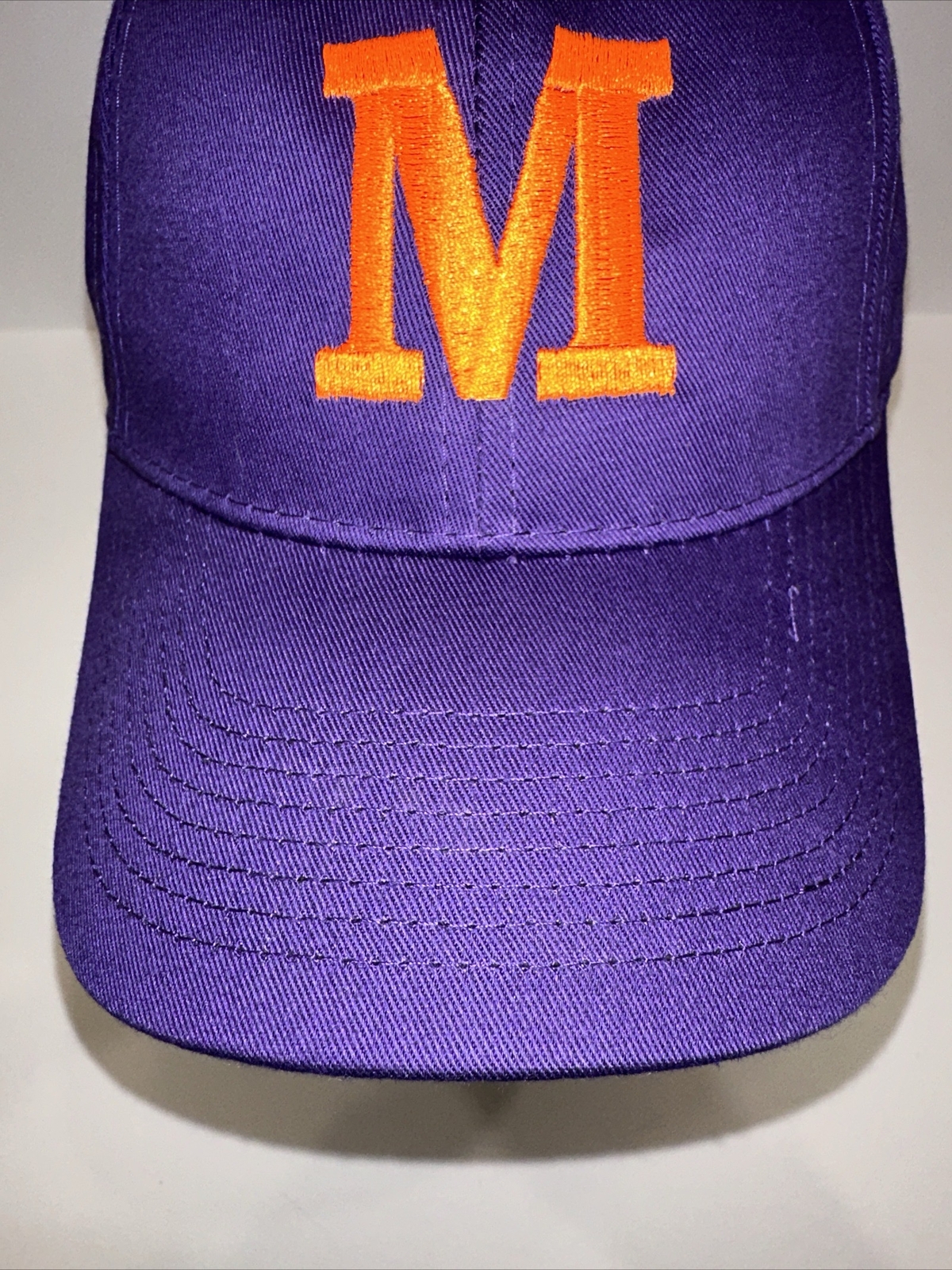 Purple Hat Cap with Orange Capitol M on the front Hook Loop