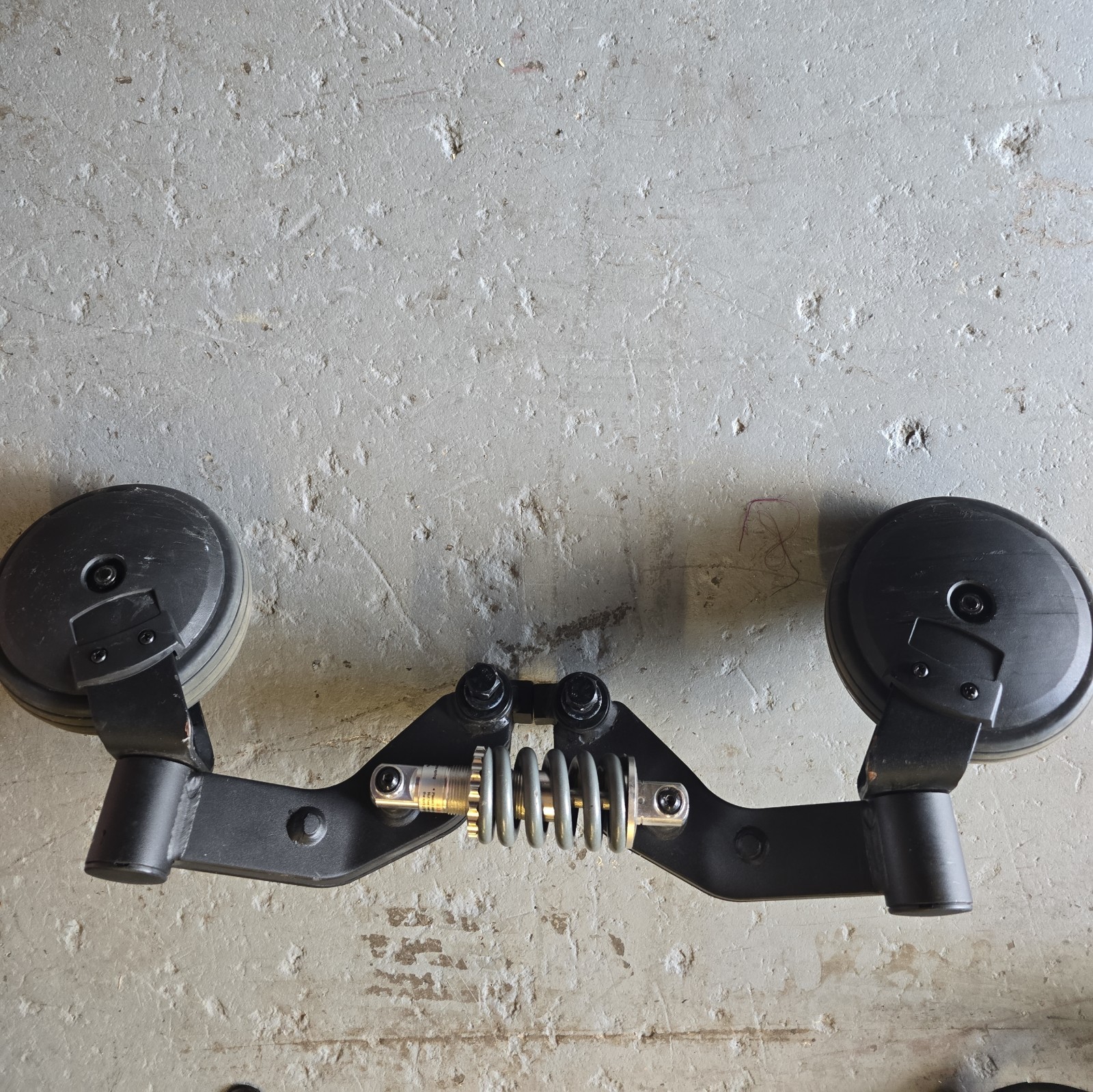 Rear drive wheel & suspension assembly of a Quantum Edge 2.0  power wheelchair.