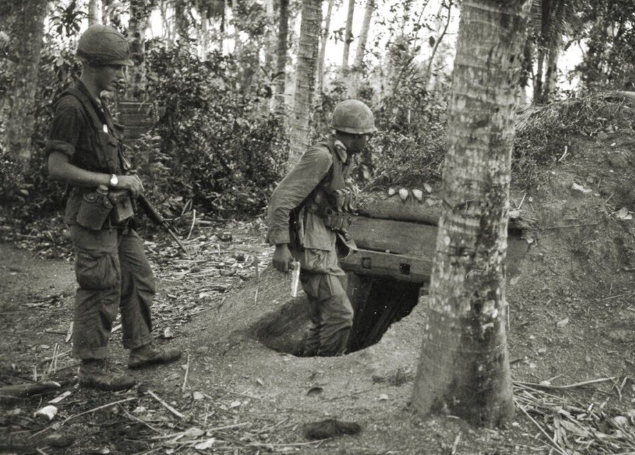 Vietnam  War  Photos -- Soldier Entering VC Tunnel