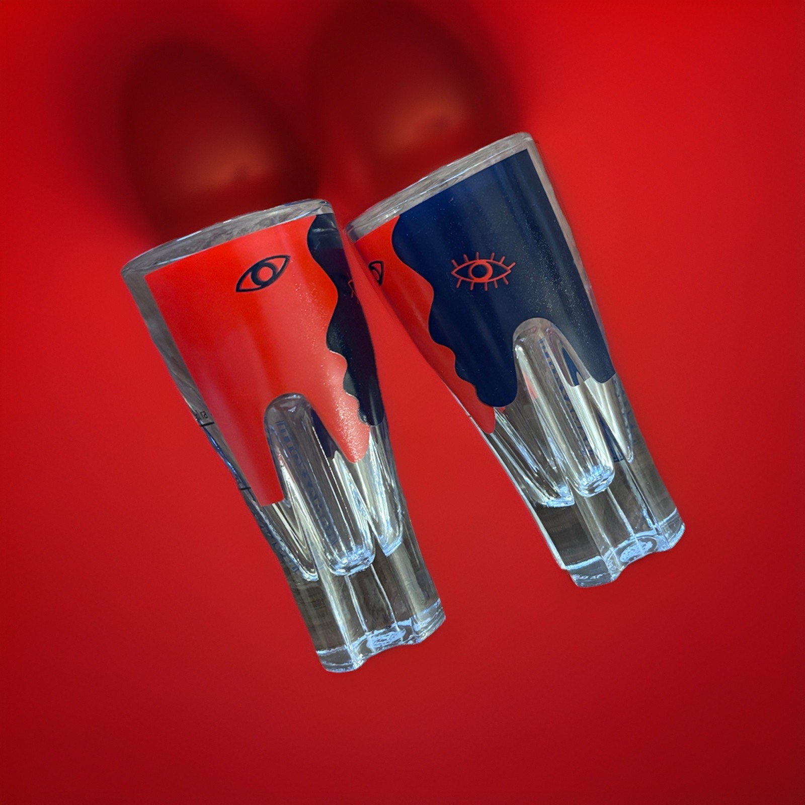 Ramazzotti Shot Glasses Red Blue Faces Set of 2 collectibles