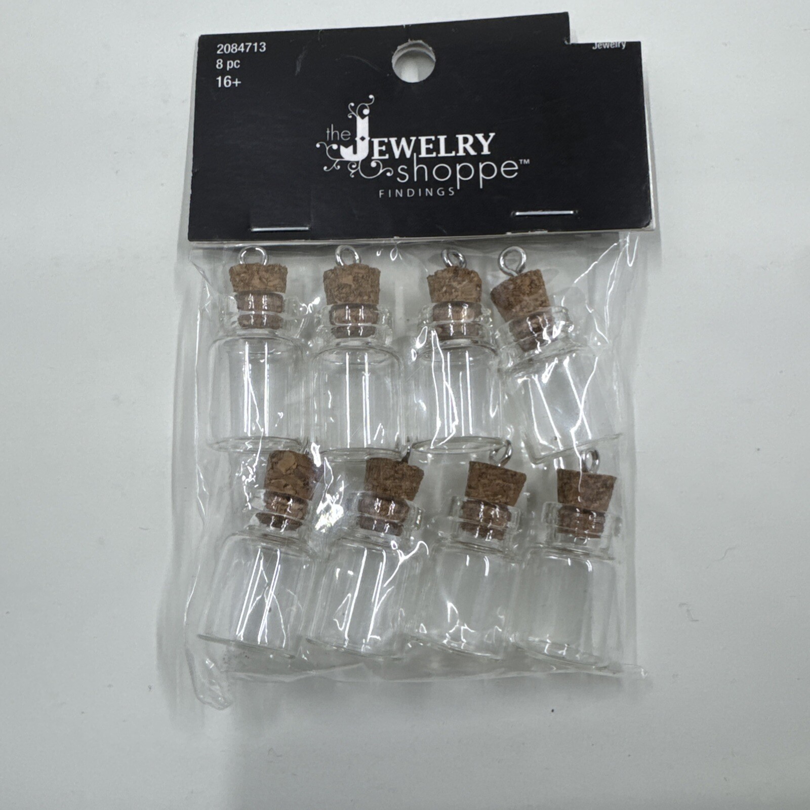 8 Pcs Jewelry Shoppe Mini Glass Bottles with Cork Charms