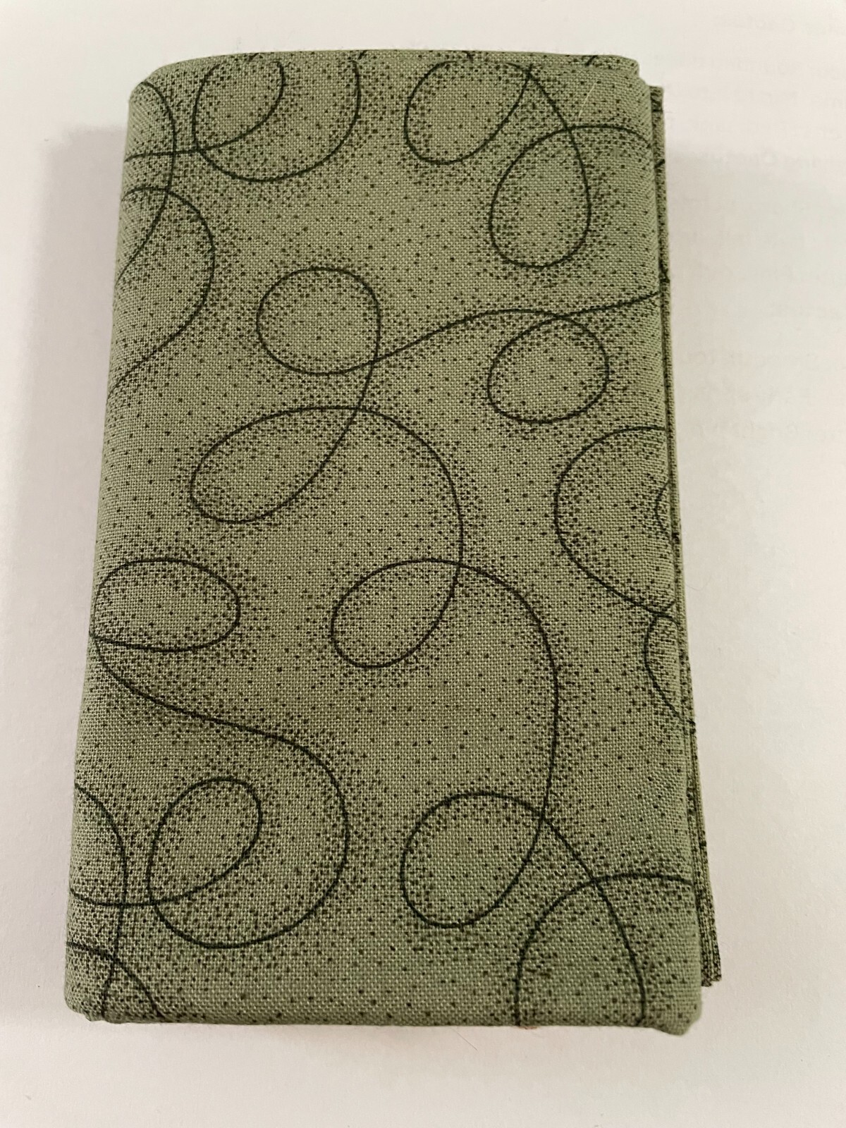 Quilting Fabric-Black design on dark green background