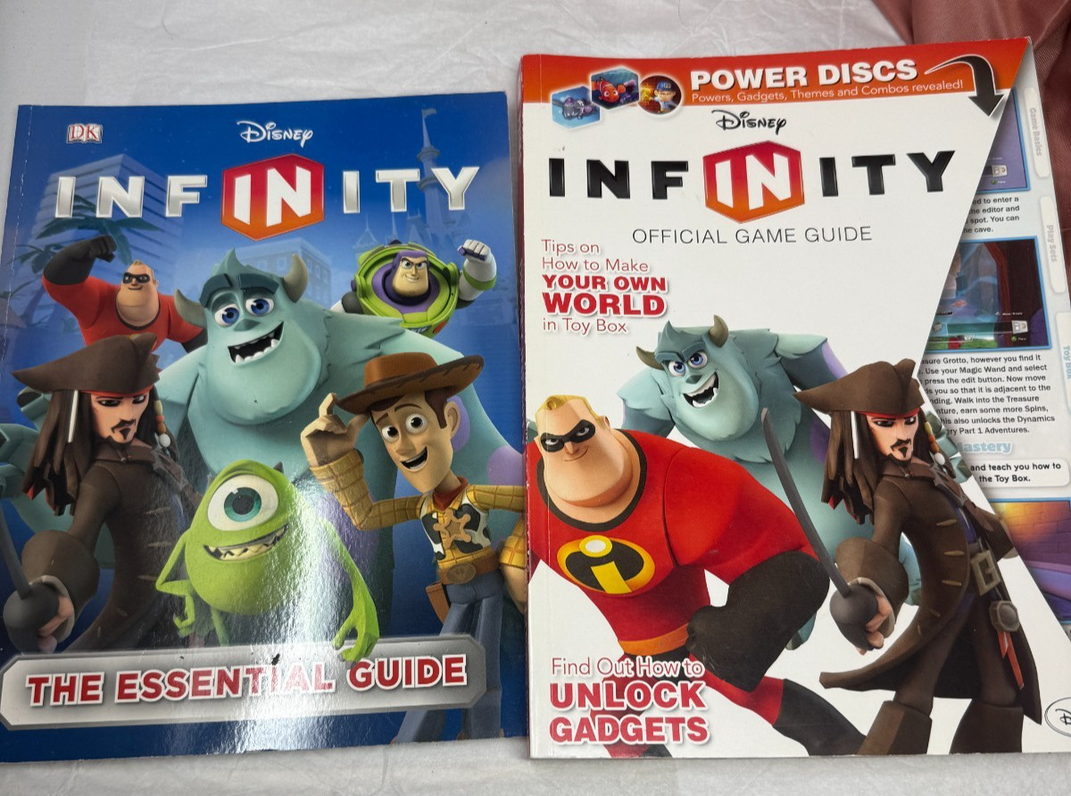 Disney Infinity Official Game Guide Books Monsters Toy Story Cars Set of 2 EUC