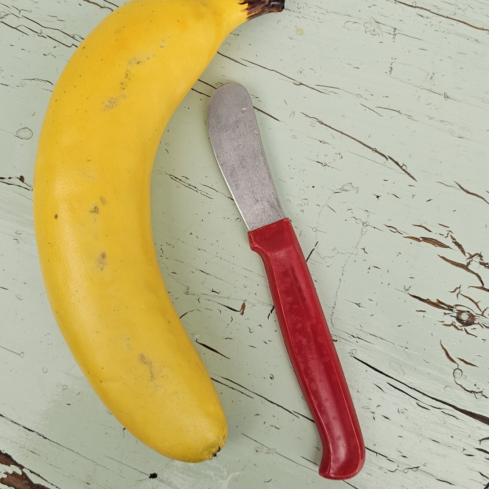 Red Stainless-steel Cheese Knife w Red Plastic Handle