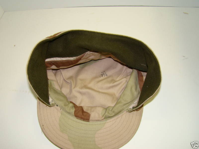 Tan Camouflage Hat with Ear Flaps.