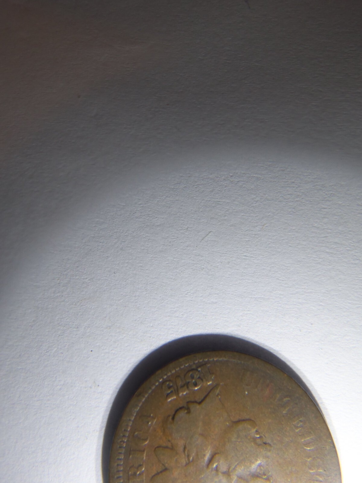 A KEY 1875 INDIAN HEAD PENNY
