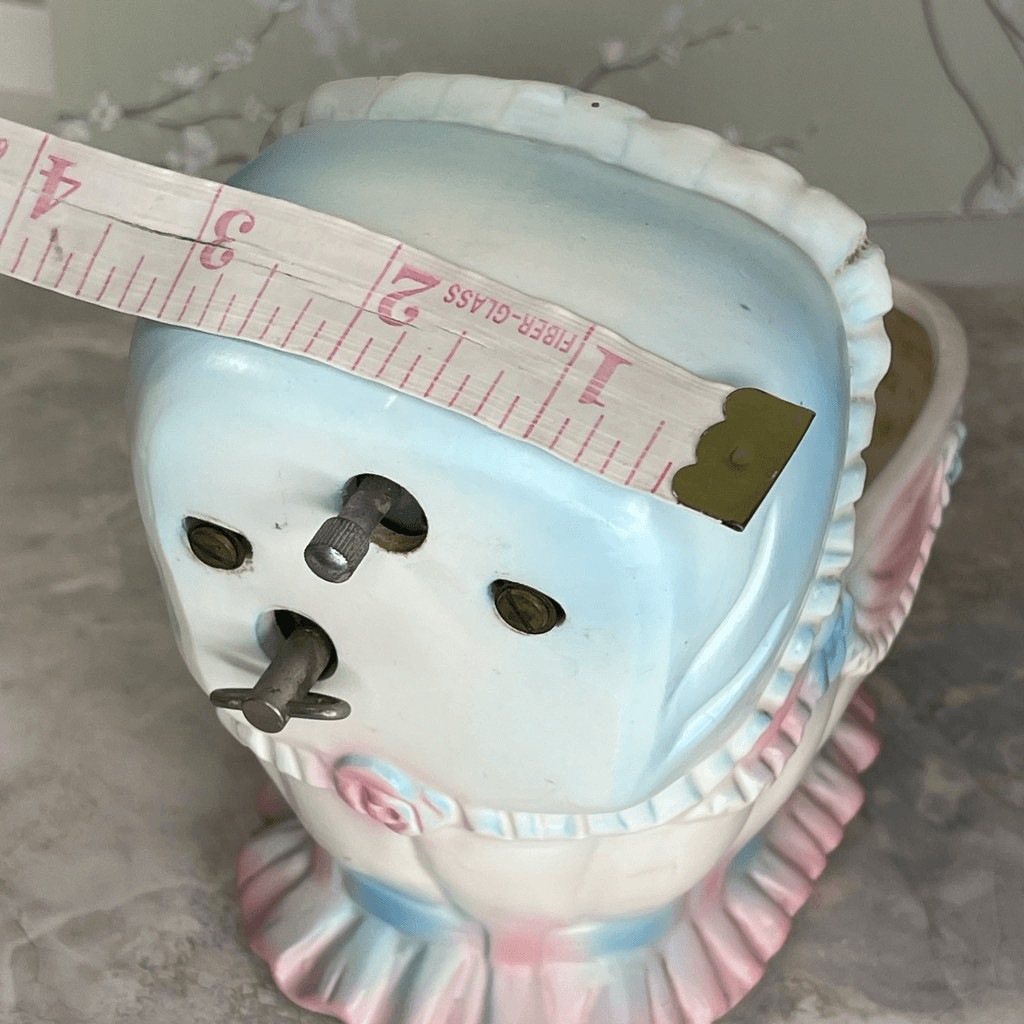 Inarco E- 3502 musical baby bassinet planter.