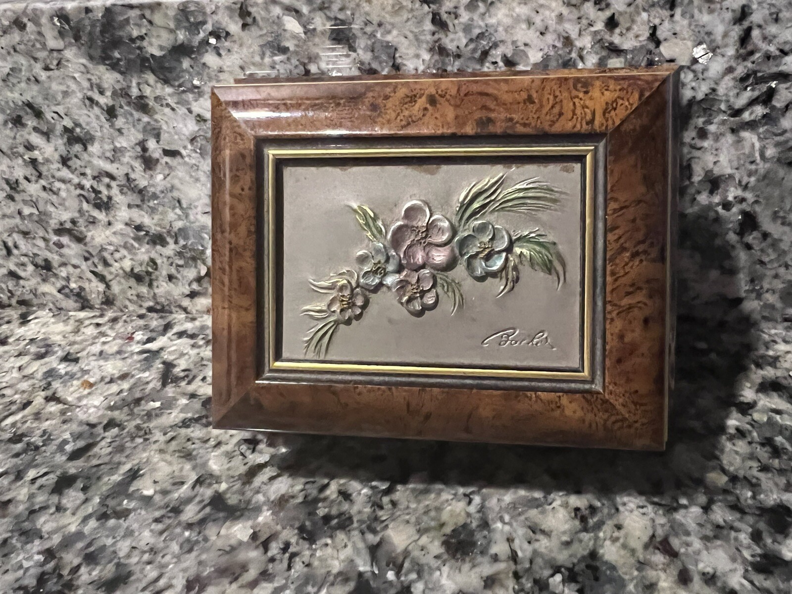 Brown hinged box with flowers on top