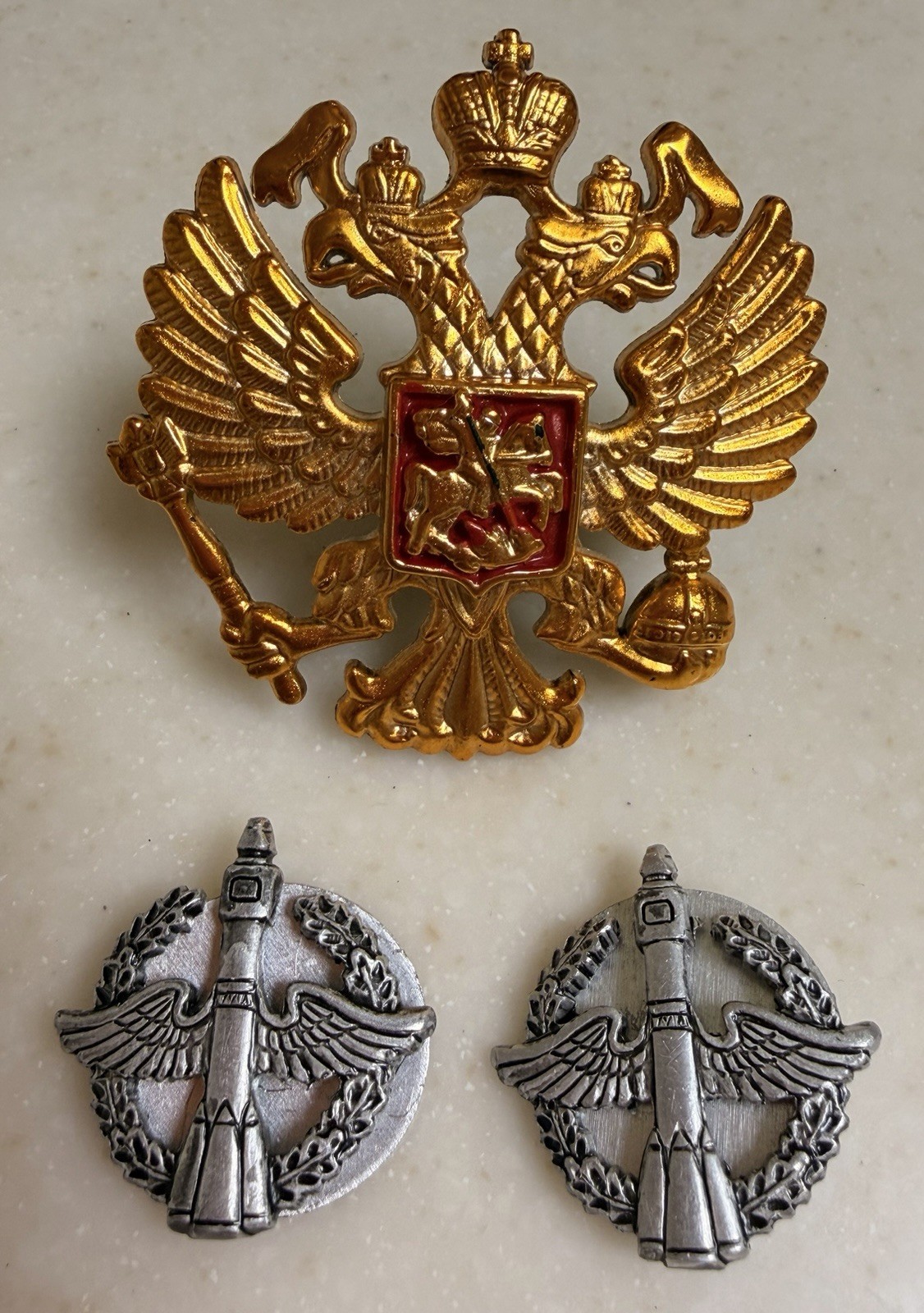 Cockade on the cap and buttonhole signs of the Space Forces Russian