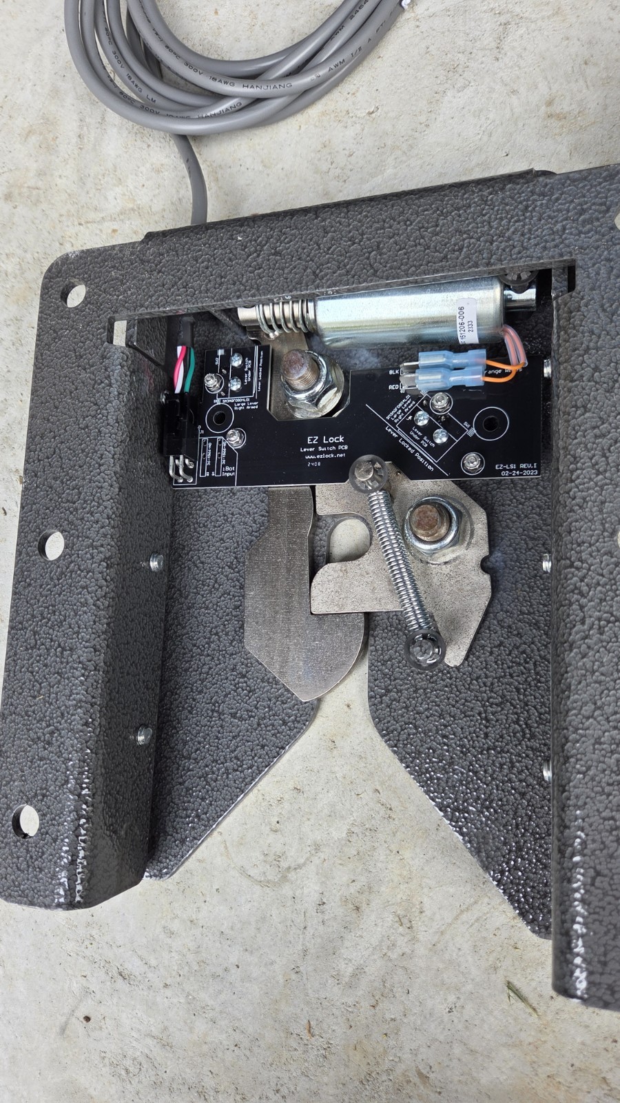 EZ Lock wheelchair lock down device like Qstraint QLock