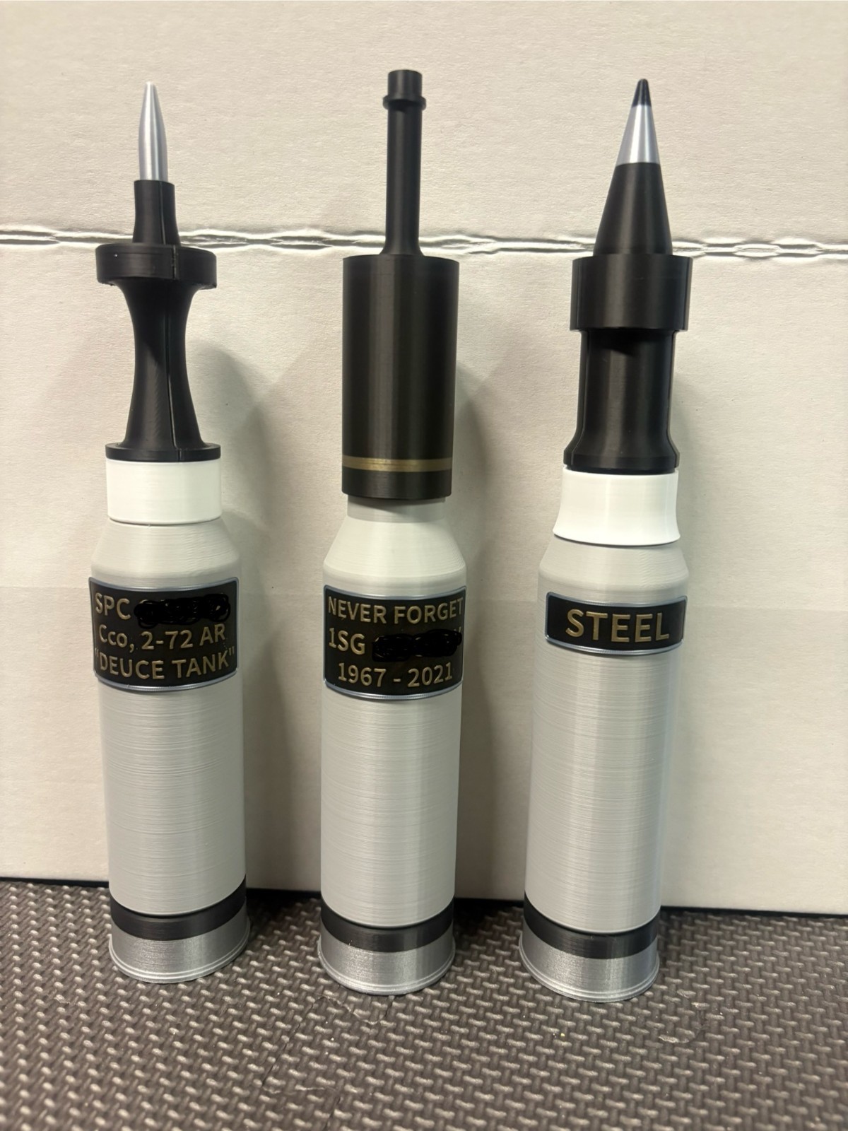 Miniature 120mm Abrams Tank Rounds - Custom plaques and added weight available.