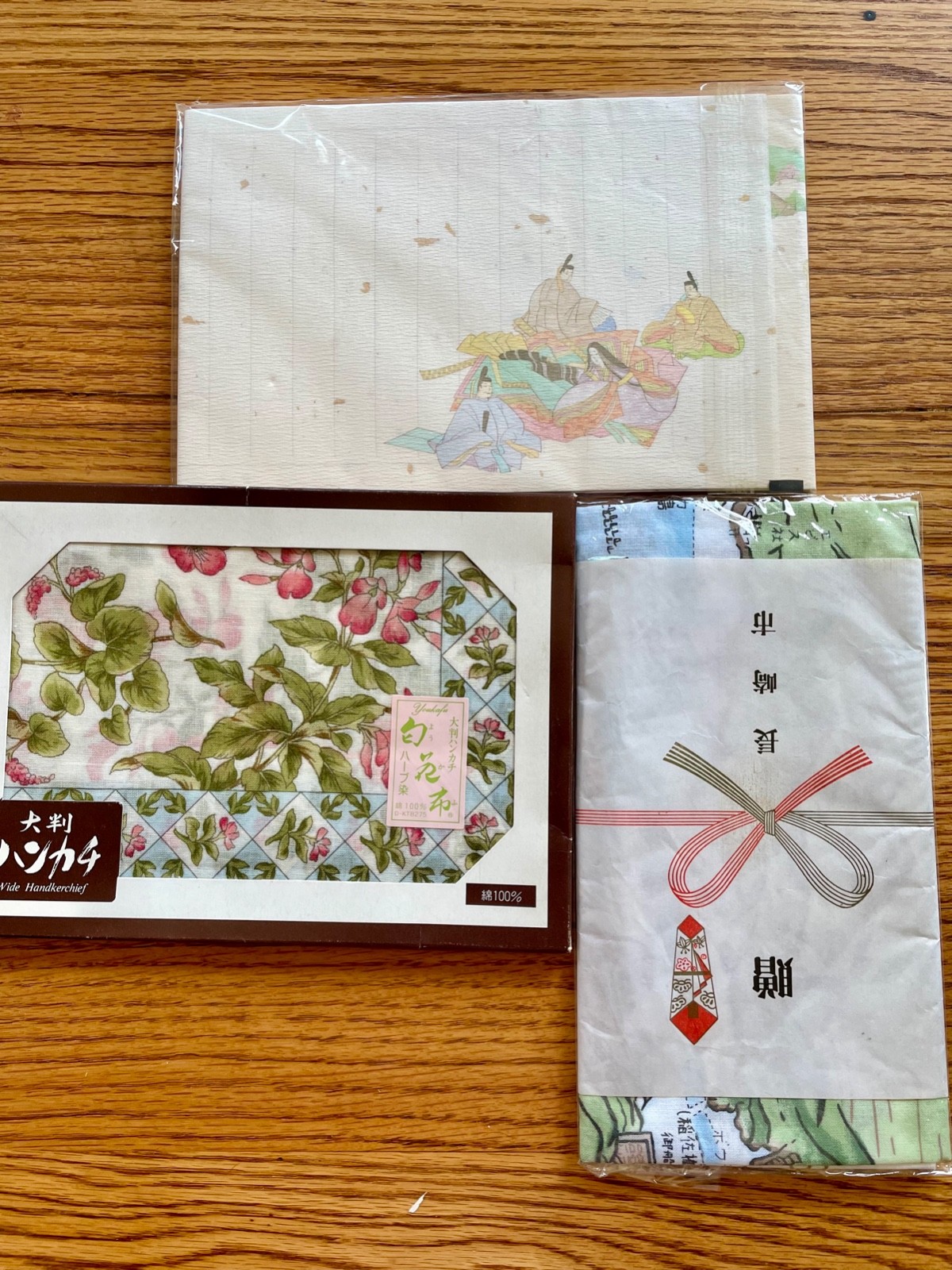 JAPANESE SOUVENIRS Postcard book, handkerchiefs, clamshell doll, stationary set