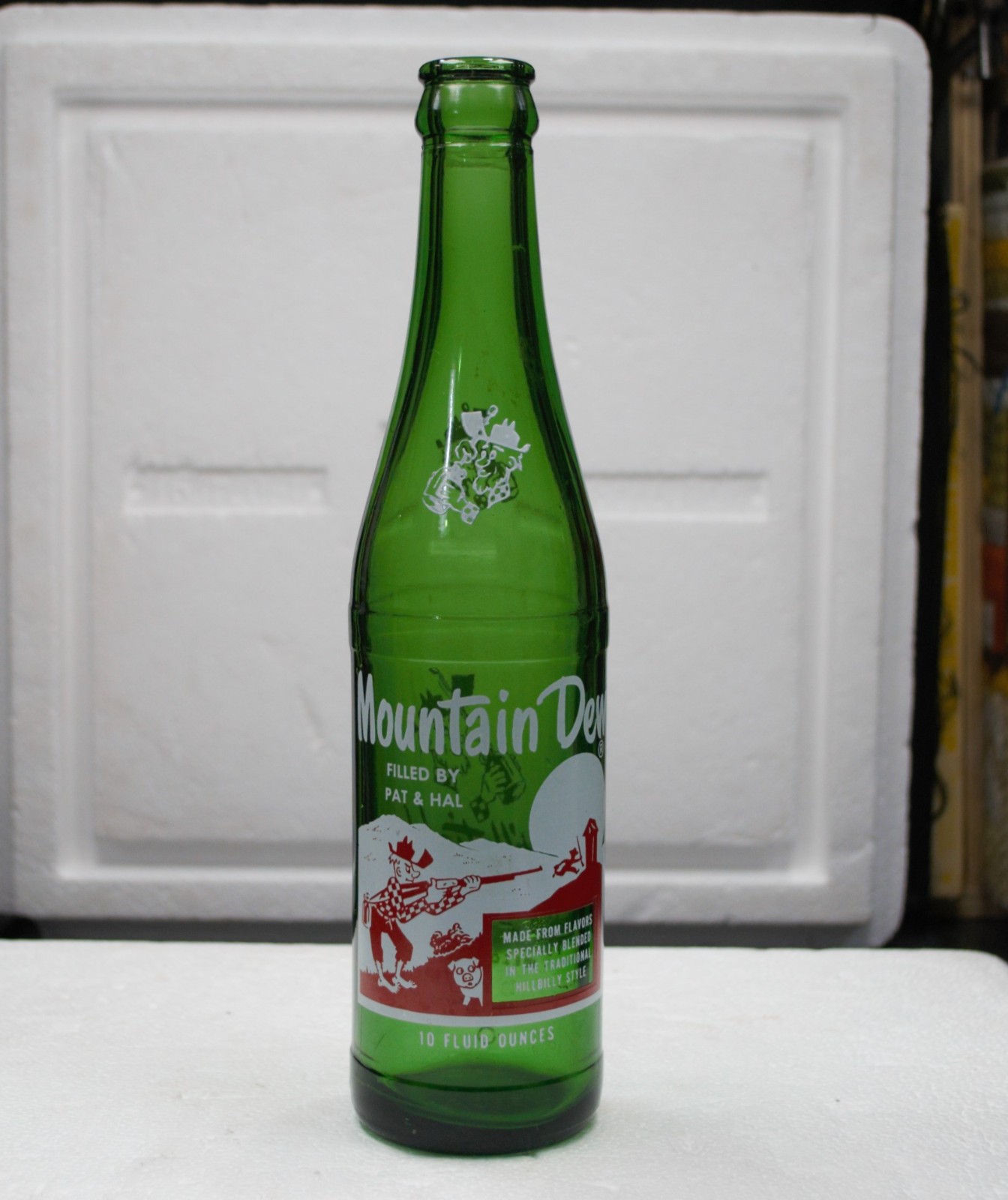 Mountain Dew 10 oz bottle, FILLED BY PAT & HAL graphics are great condition