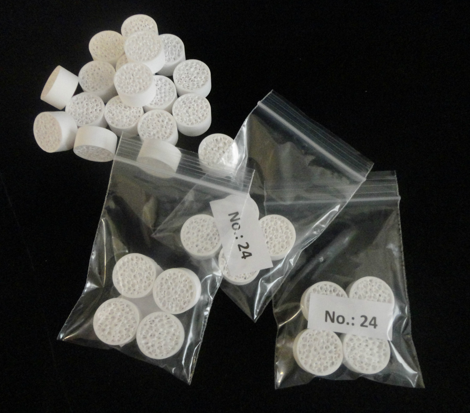 LOT OF EIGHT (8) SMALL RETICULATED ALUMINA MOLTEN METAL FILTER SETTER  No.: 24