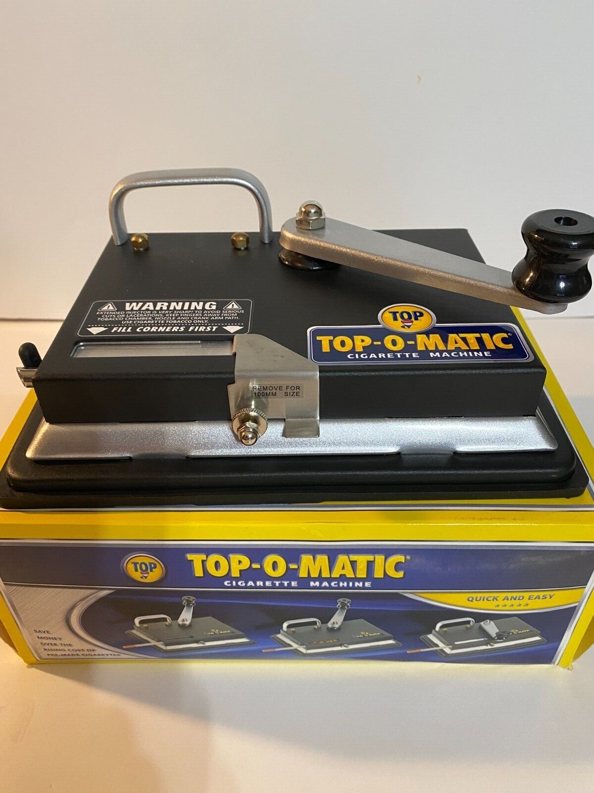 BRAND NEW, OPEN BOX, NEVER USED, TOP-O-MATIC CIGARETTE ROLLING MACHINE.