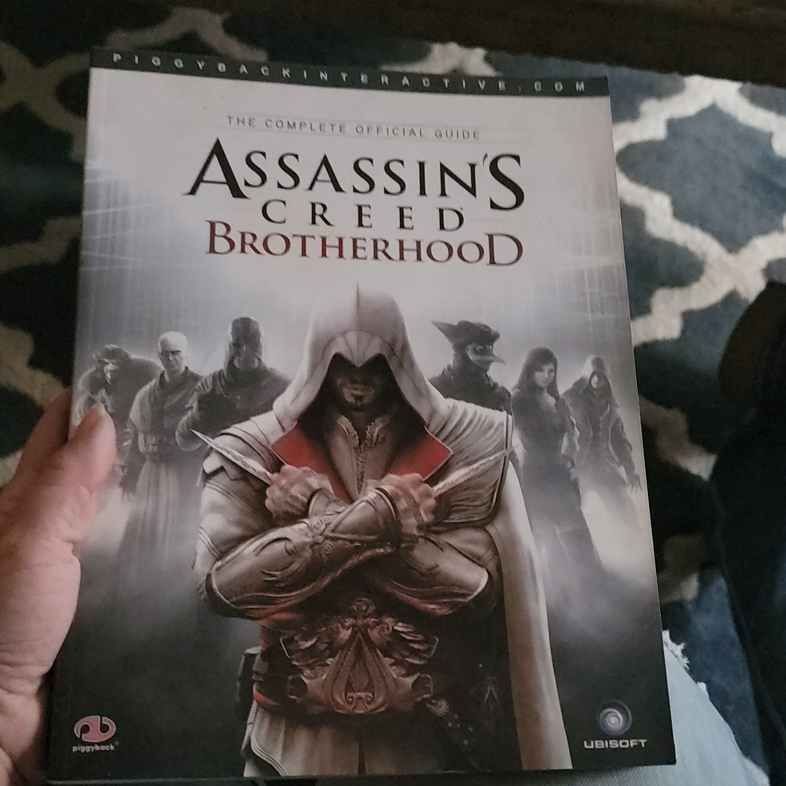 Piggyback Assassin’s Creed: Brotherhood Strategy Guide w/ Map Poster
