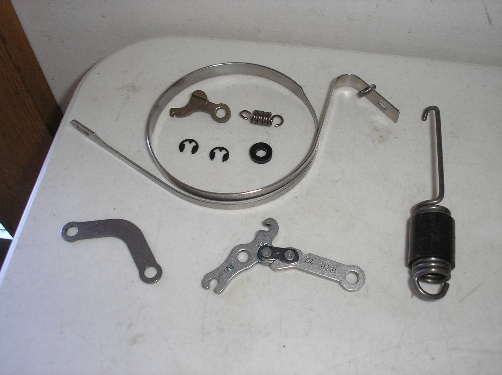 NEW GENUINE OEM STIHL MS271 CHAINSAW / CHAIN BRAKE ASSEMBLY LINKAGE SPRING BAND