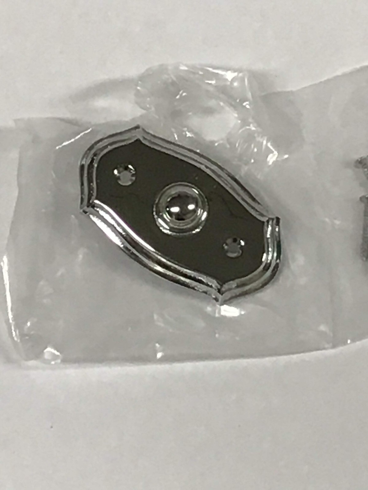 Chrome colored door bell switch