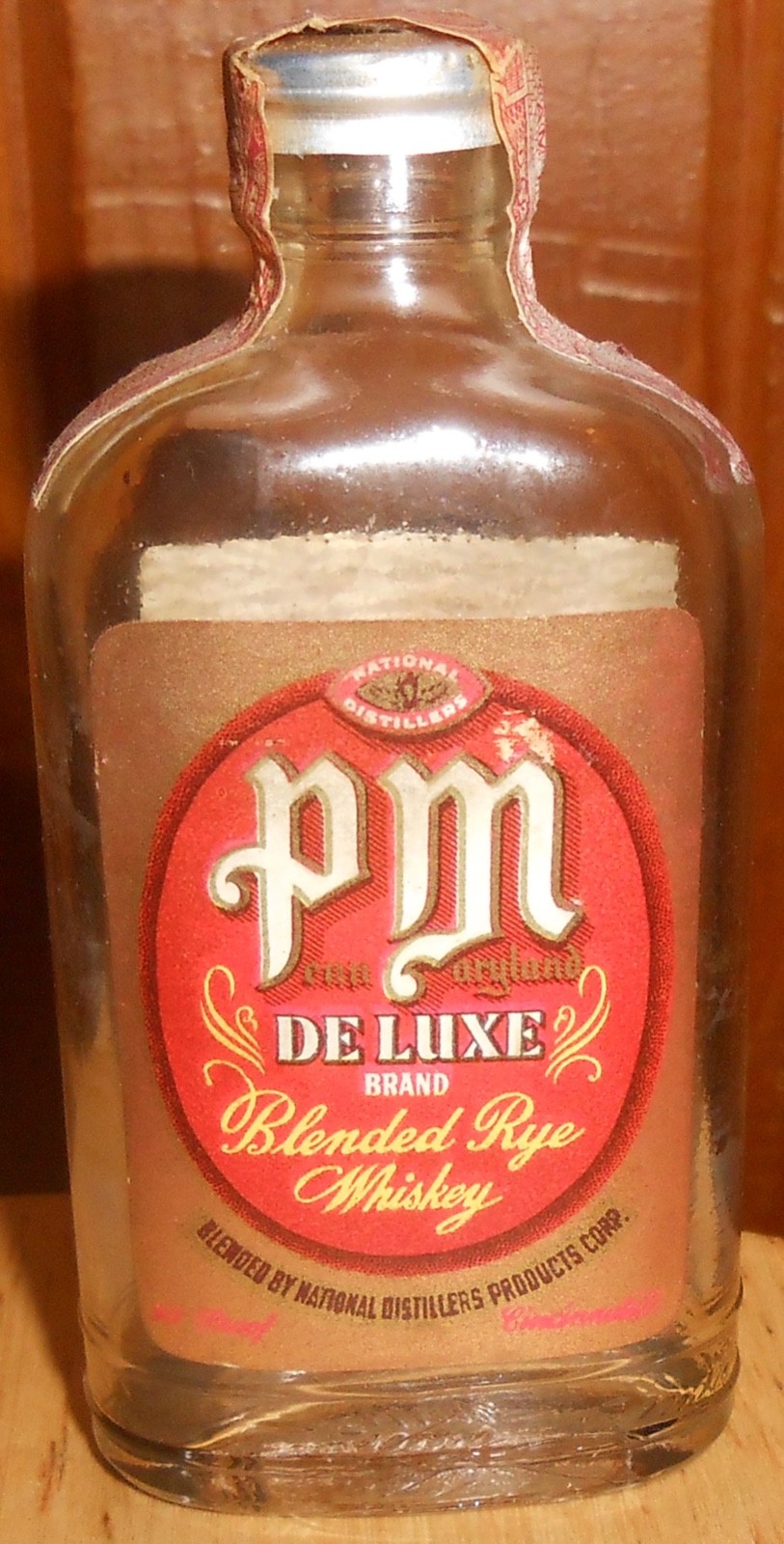 PM Rye whiskey miniature bottle, empty