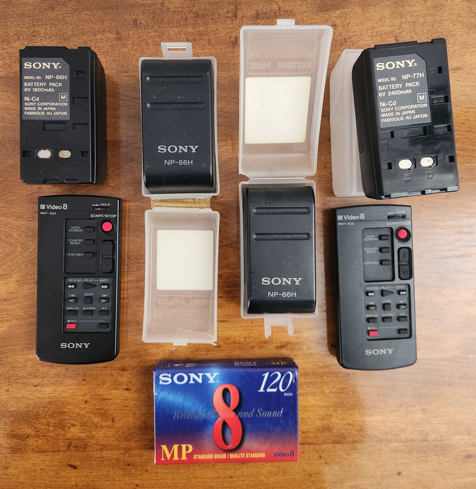 3 Sony NP-66H Batteries 1 NP-77H Battery 2 RMT-502 Remotes Untested 1 New Tape