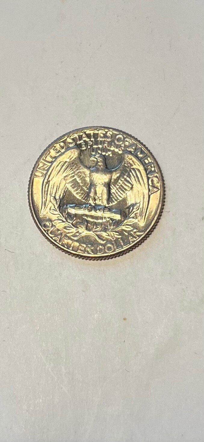 1966 Washington Quarter — copper showing on obverse