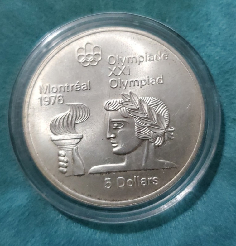 1976 Montreal Canada Summer Olympics "Athlete with Torch" .999 Fine Silver Coin