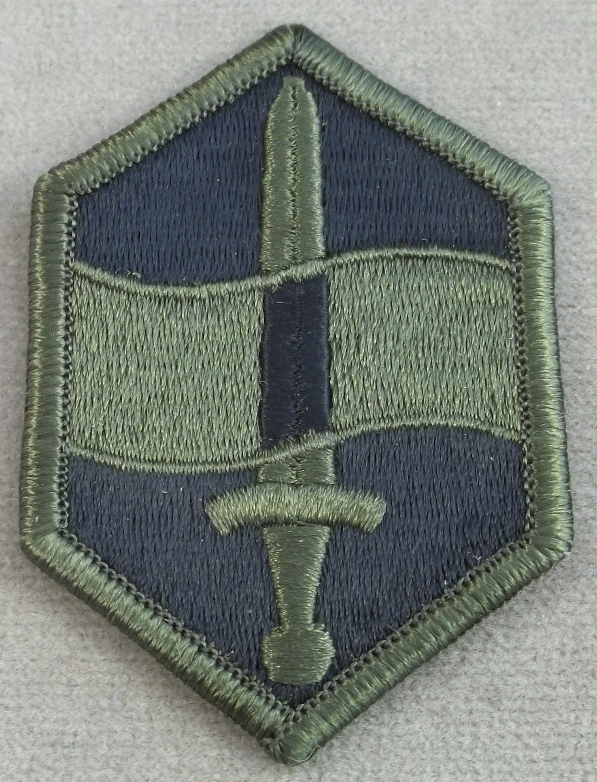 US Army 460th Chemical Brigade Subdued Merrowed Edge Patch
