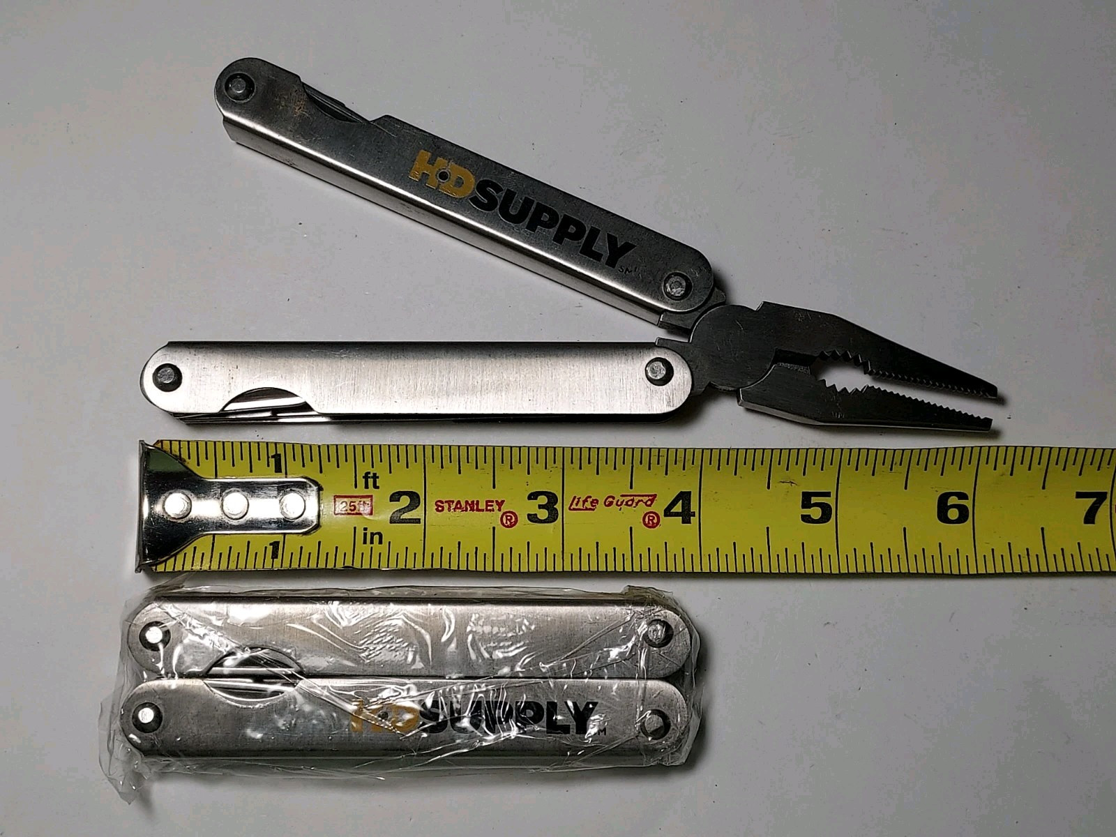 2 HD Supply Multi Tools with Nylon Pouch - 1 used, 1 new