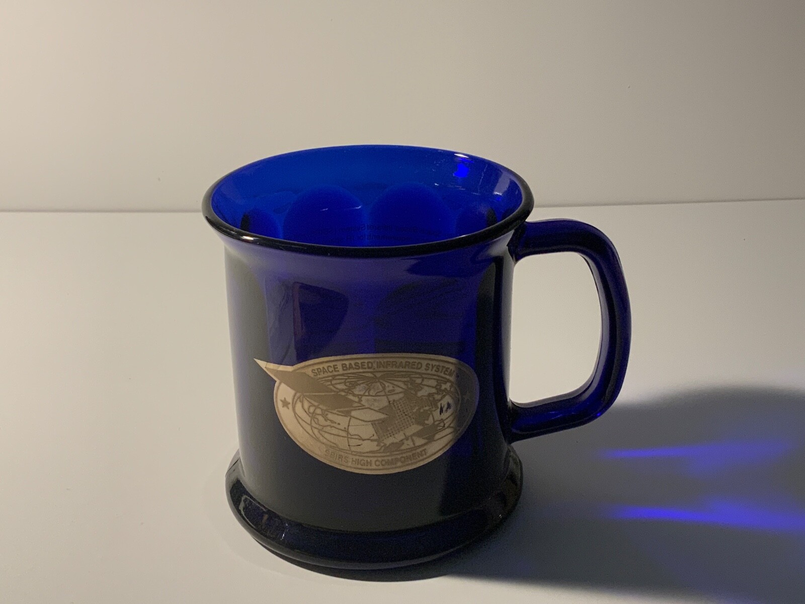 TRW SPACE BASED INFRARED SYSTEM MUG. SBIRS HIGH COMPONENT MUG BLUE GLASS