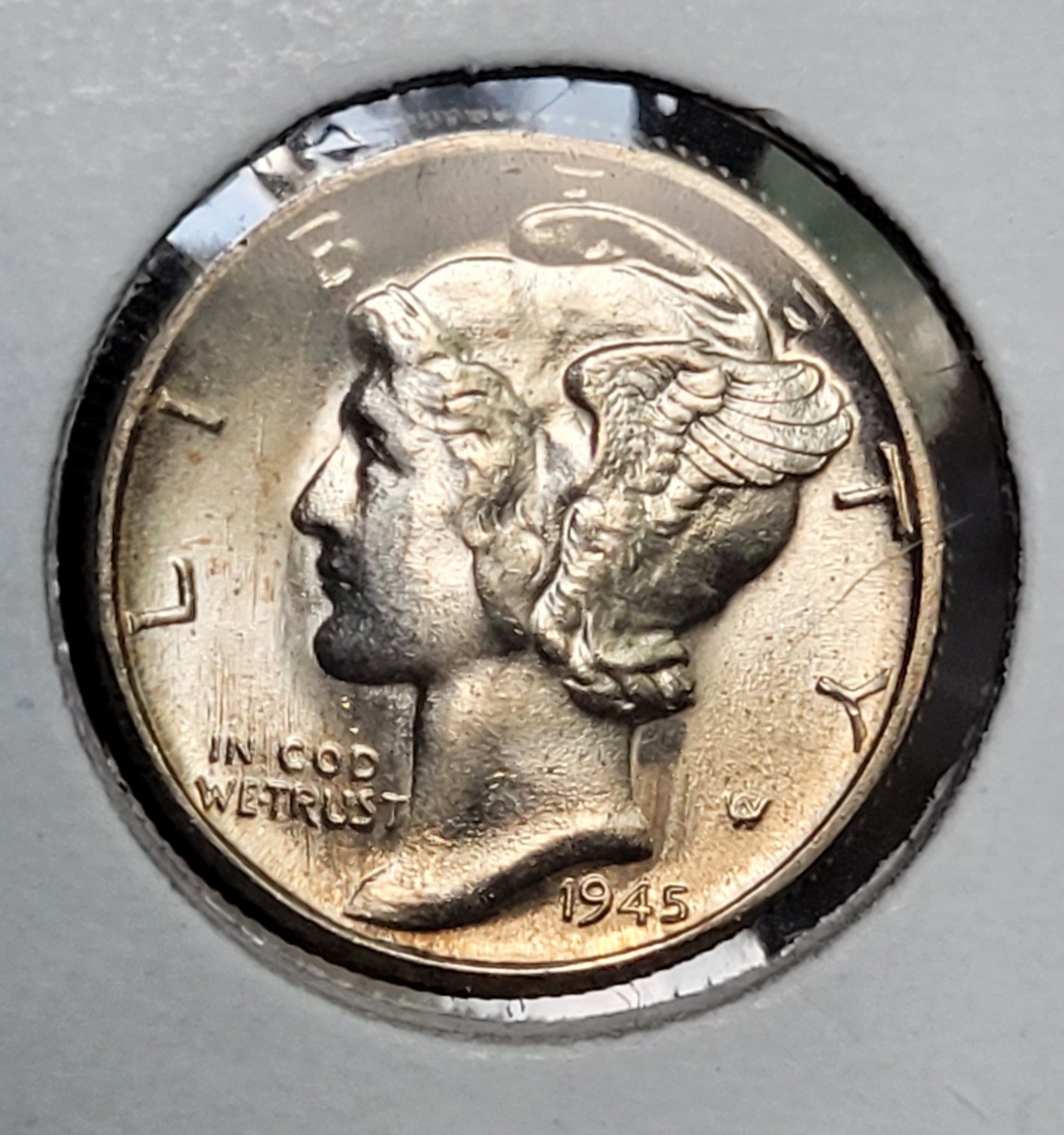 1945  Silver Mercury Dime  uncirculated  light toning on front