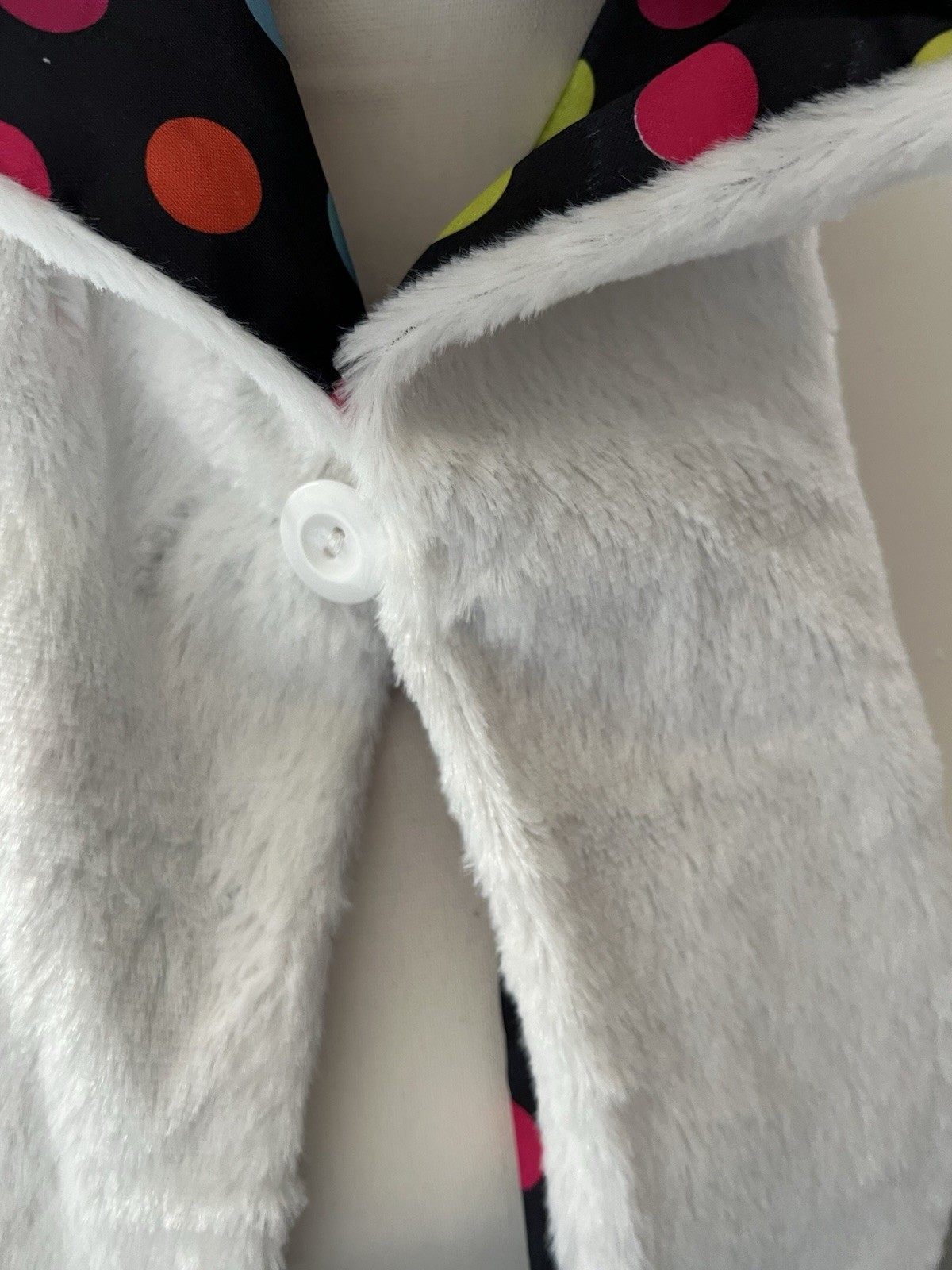Hello Kitty Hat Hood in white with a pink bow and a polka dot lining.