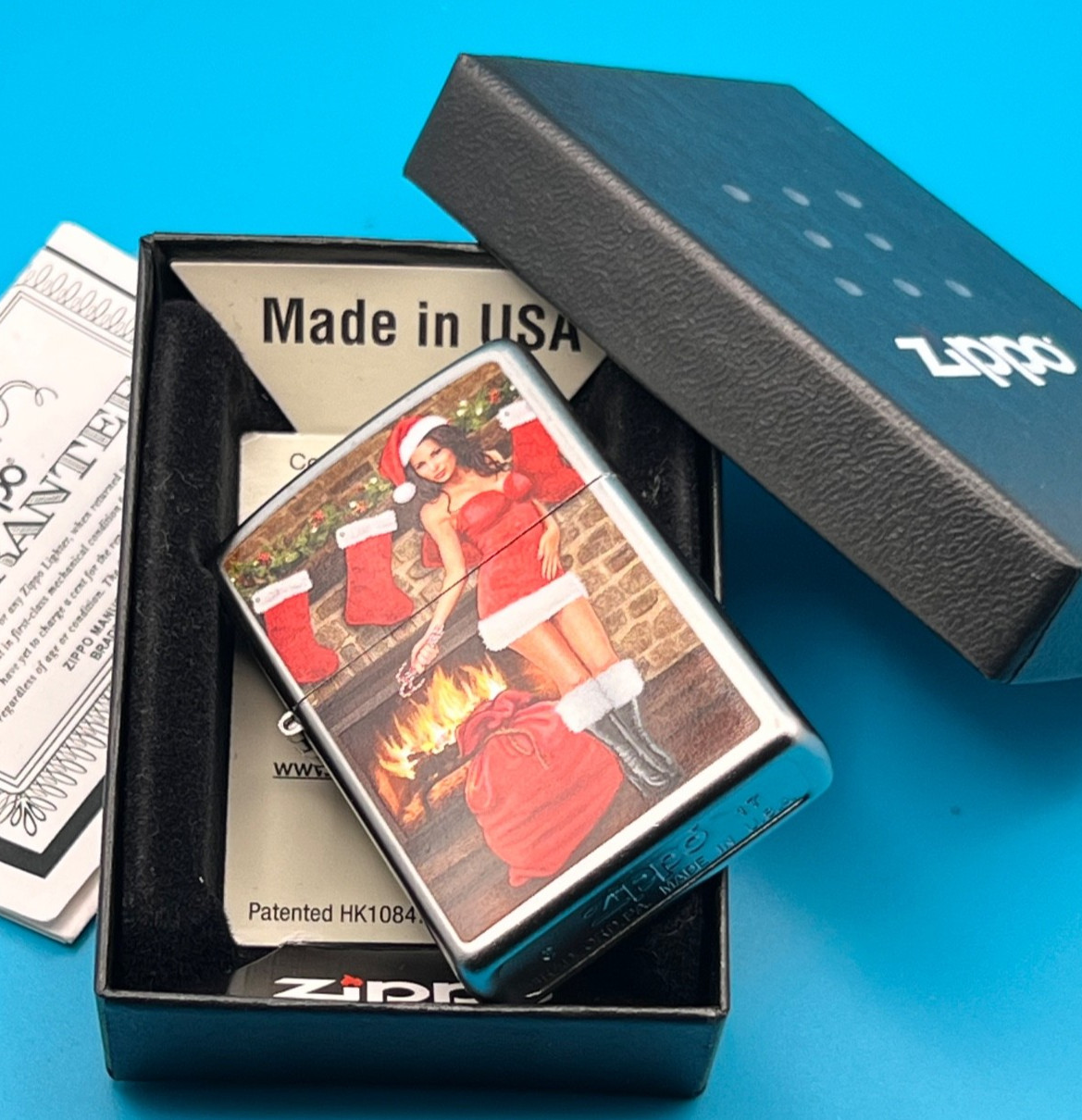 Genuine Brand New 2017 ZIPPO Lighter PULLING A CRACKER BY THE FIRE Satin Chrome
