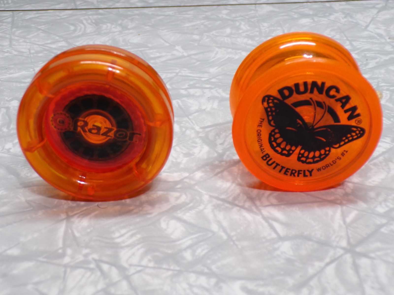Pair of Vintage YoYos, Duncan Butterfly and a Rare Razor. Both in Good Cond.