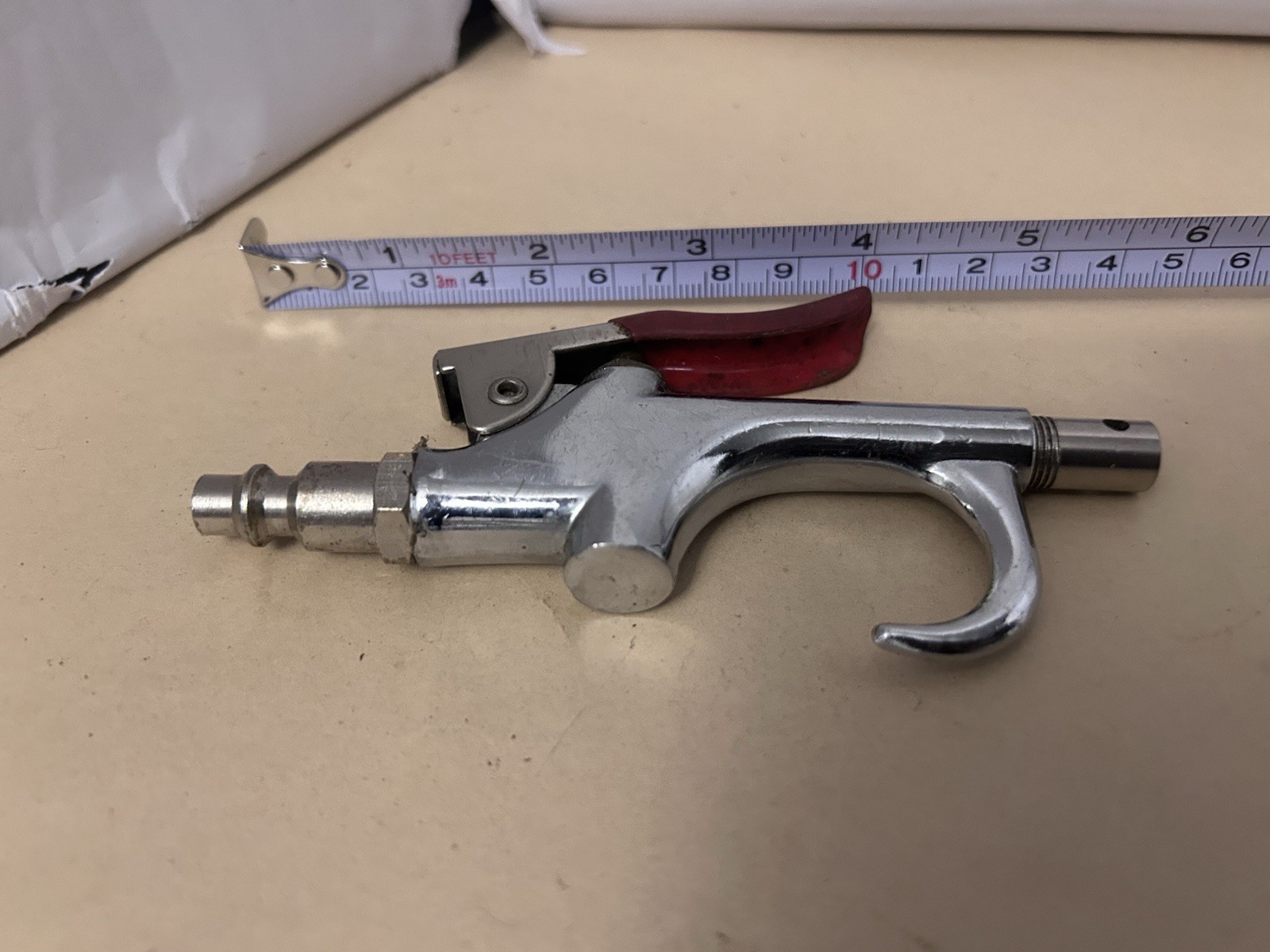 Unbranded untested pneumatic air gun with red handle