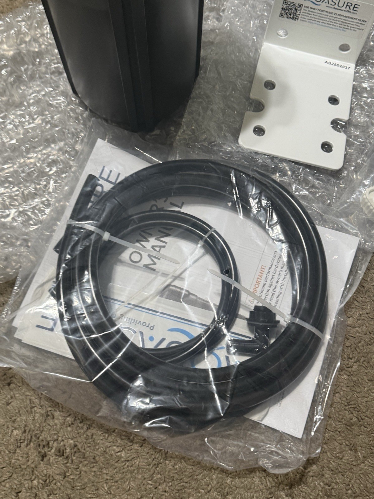 AQUASURE REPLACMENT FILTER CANSITER AND MOUNTING BRACKET AND HOSE TOOLS ETC.