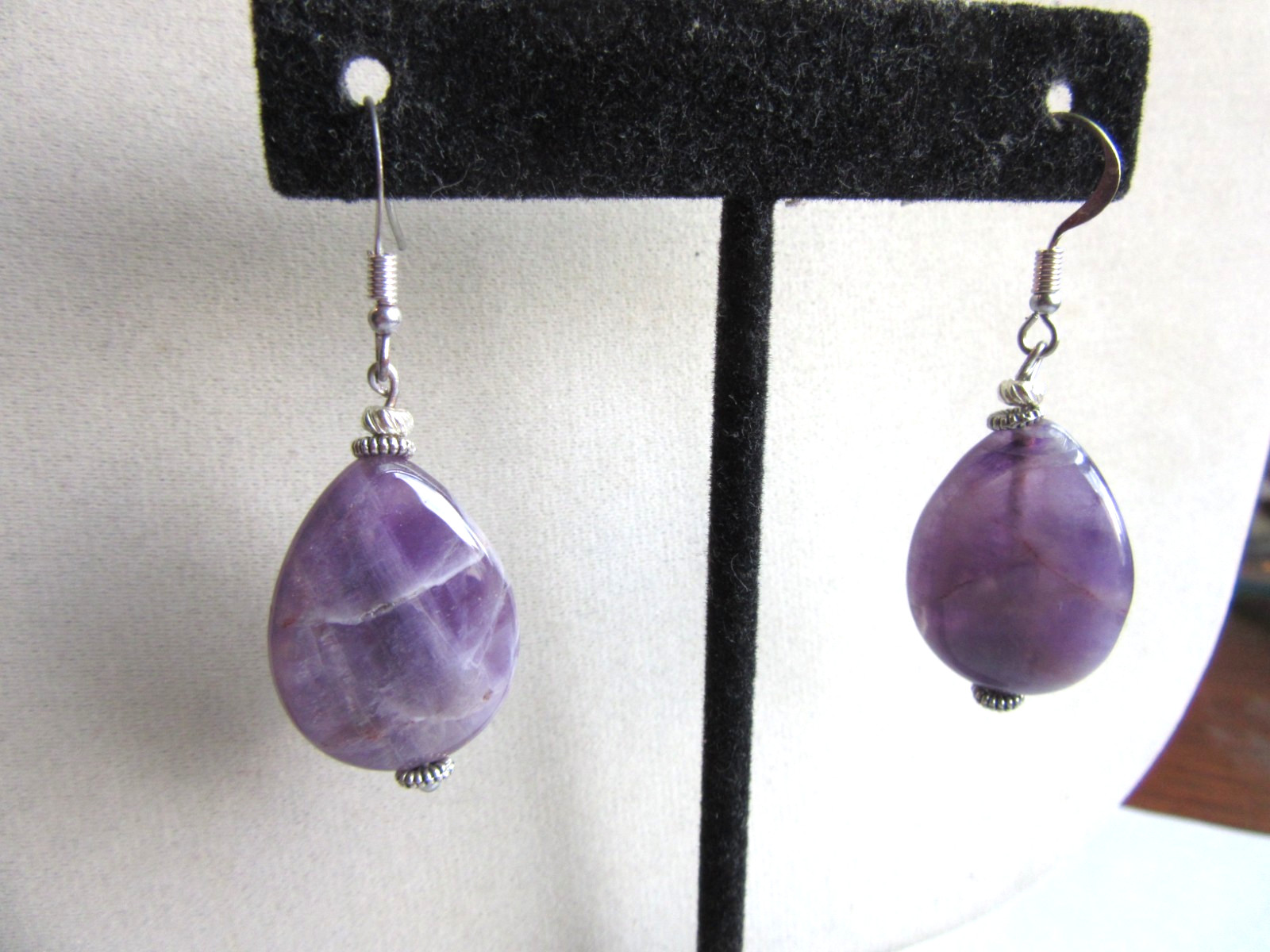 Polished oval natural Amethyst drops pierced earrings