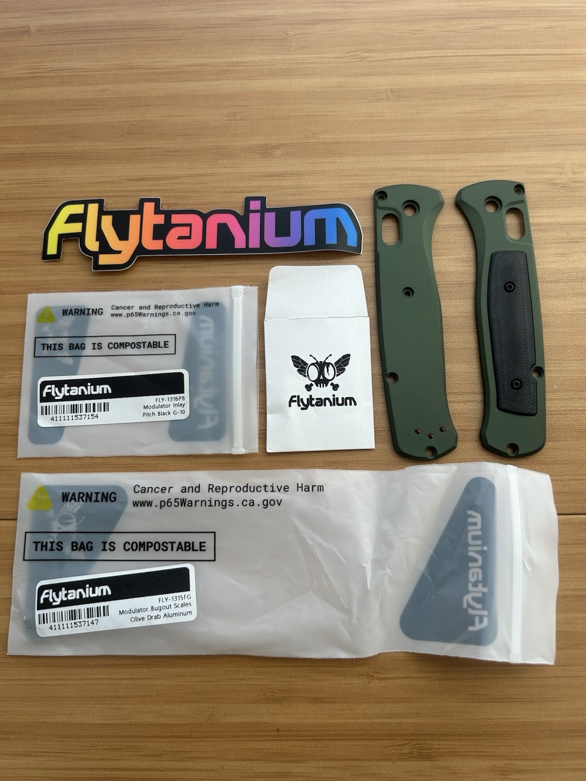 Benchmade Bugout 535 Flytanium Modulator Scales - Olive Drab Alum / Black G10