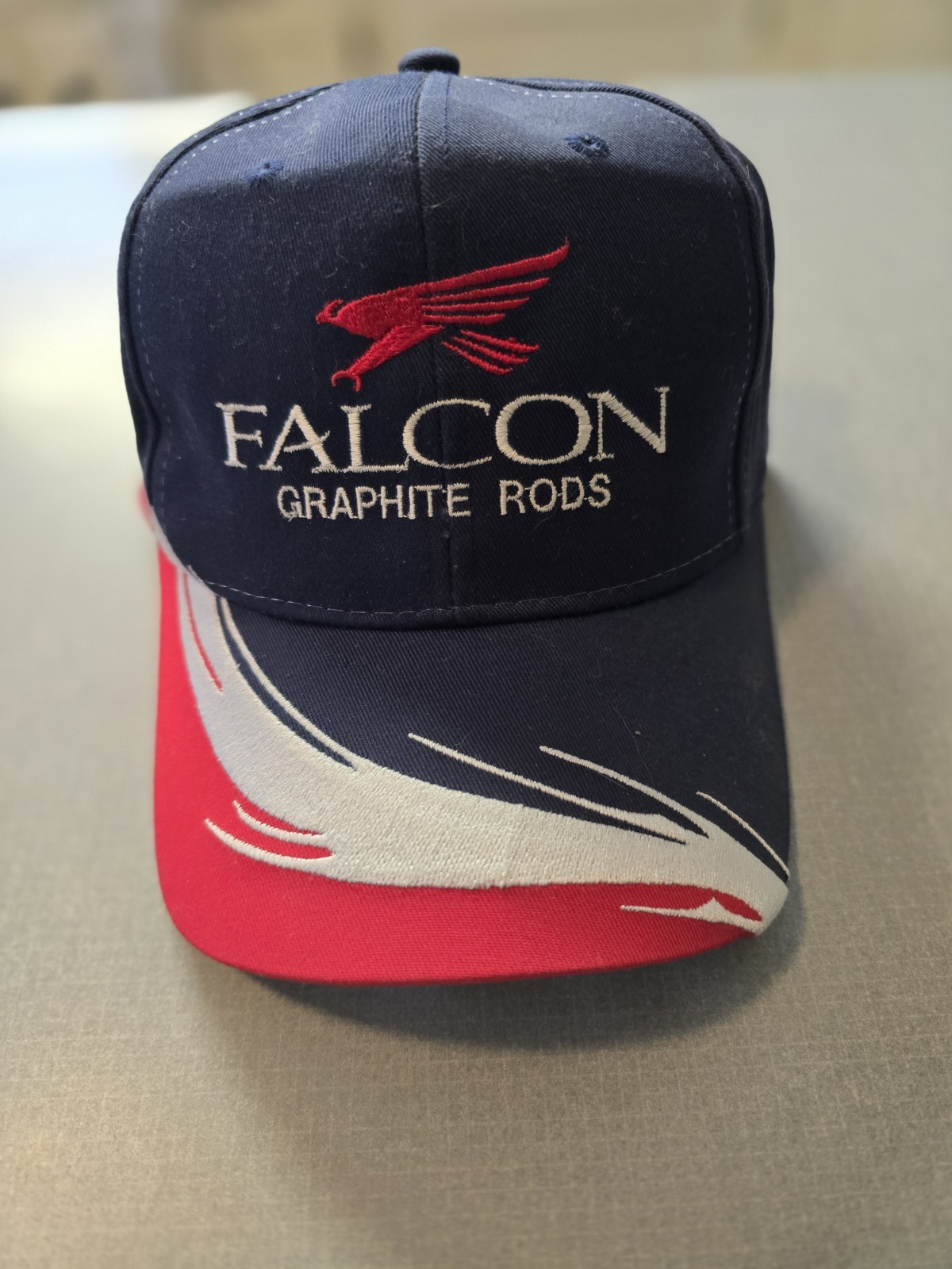 OC Falcon Graphite Rods Ball Cap With Graphic Design On Bill and Side.