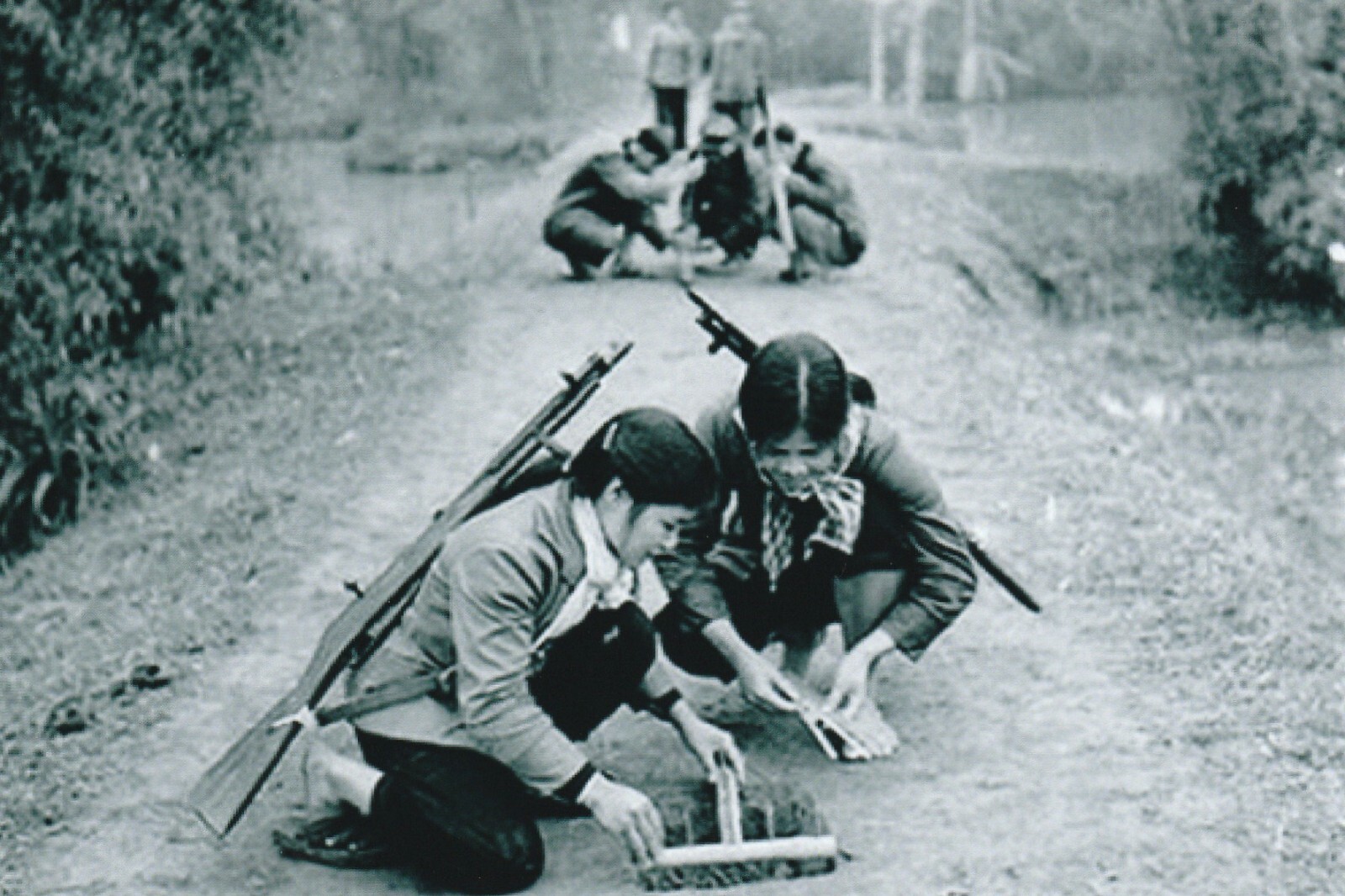 Vietnam  War  Photos --  Viet Cong Female Soldiers Planting Booby Traps....