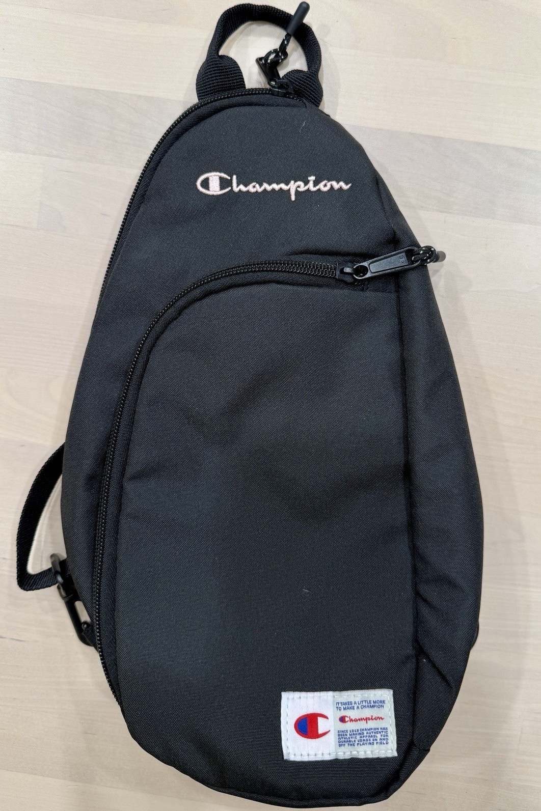 Champion Black Small 5L Sling Backpack Adjustable Strap Zipper 2 Pockets