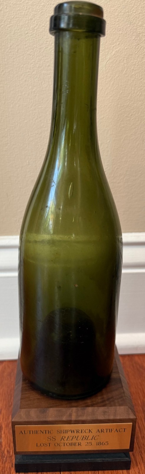S.S. REPUBLIC SHIPWRECK CHAMPAGNE BOTTLE  ARTIFACT W/ WOOD BASE, BOOK, NO COA